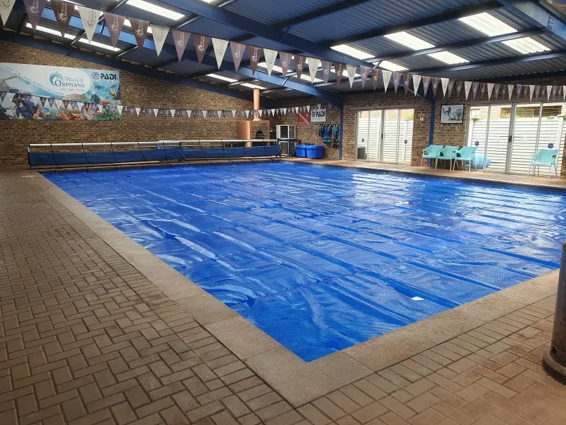 Commercial size pool solar cover installation Commercial size pool solar covers
